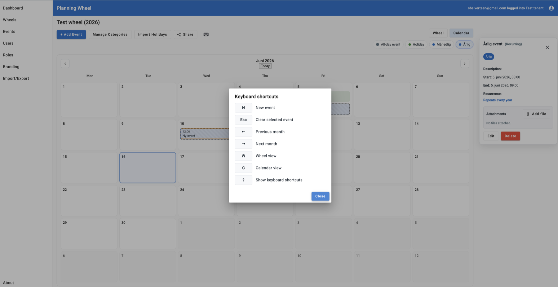 PlanningWheel calendar view with event details, attachments, add event controls, category filters, and a keyboard shortcuts dialog.